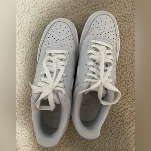 Grey and white Nike women’s court vision low sneaker